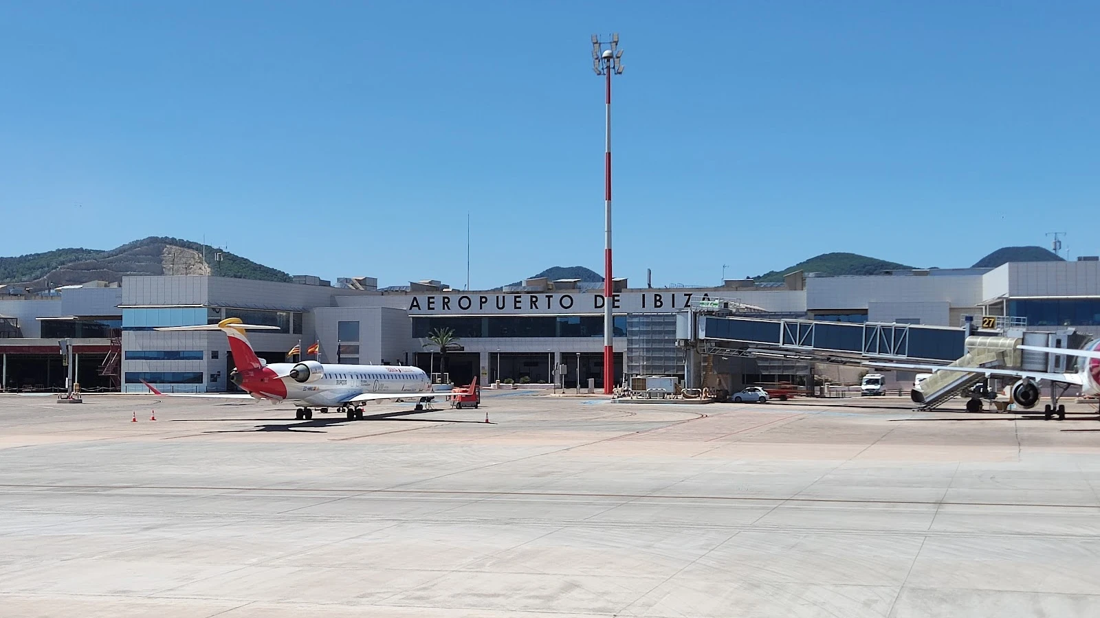 Rental car fleet parked at Ibiza Airport pickup zone